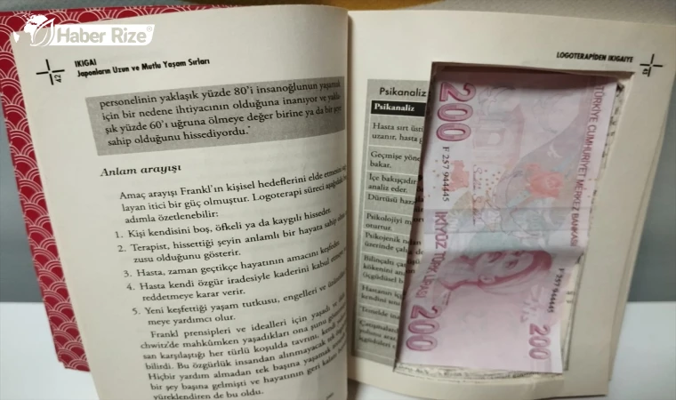 Sahte parayı saklamak amacıyla kitabın içini para ölçüsünde kesen 2 zanlı yakalandı